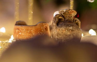 Decorated Christmas tree and creche on a blurred background, and you can see the lights and the warm colors which give it a true spirit and mood