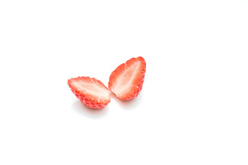 One cut strawberry placed on white background.