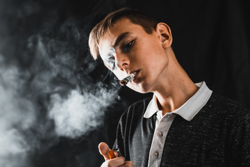 A teen Smoking a cigarette or drugs is a rolled dollar, the concept of teen addiction and spending...