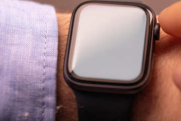 Close up of Businessman's hand looking at hand watch
