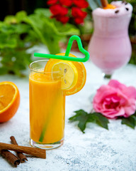 orange juice with a slice of orange and lemon