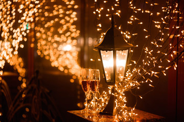 Two glasses of champagne over blur spots lights background. Celebration, free space for text