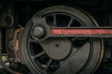 Fototapeta premium Close up of the drive wheel from an old steam locomotive