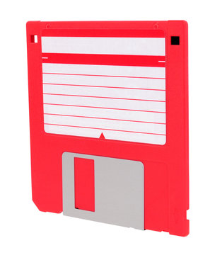 Red 3.5 inch compact floppy disk with blank label isolated on a white background