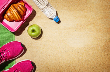 Top view beach and fitness accessories. Background with copy space
