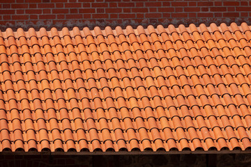 The surface of the roof of red tiles.