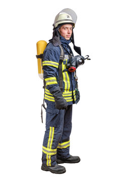 Young fireman with a mask and an air breathing apparatus on his back in a fully protective suit