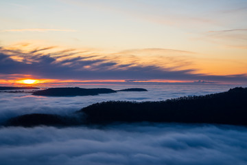 Germany, Magical aerial view above endless lake of fog clouds in valley of swabian alb nature...