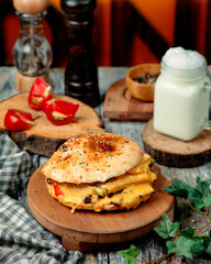meat doner in a round tandoor with cream cheese