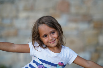 4 year old girl looks sideways