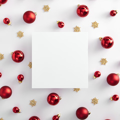 Red christmas ball and gold snowflake with paper blank