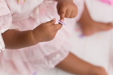 a child holding confetti . child's hand
