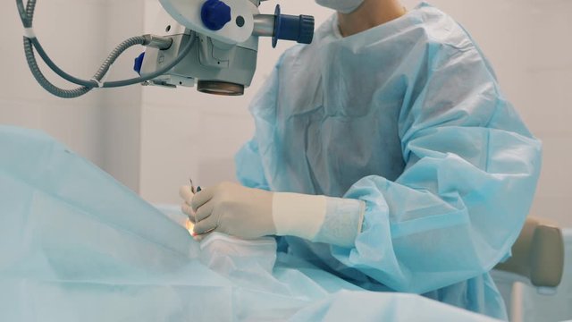 Female surgeon during an eye operation