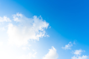 Nature Bright blue Sky with white clouds on blackground. Beautiful sky and clouds in the afternoon.
