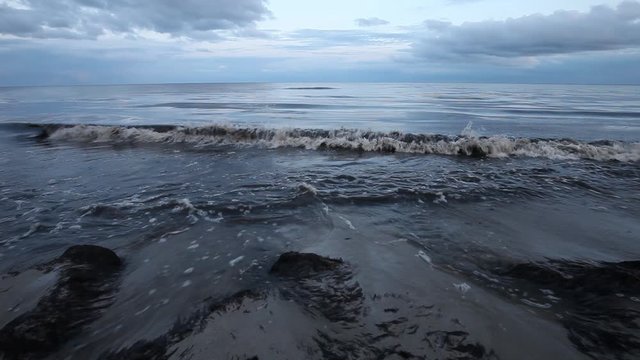 Cinematic view of the waves on the beach of Beddingestrand in Sweden