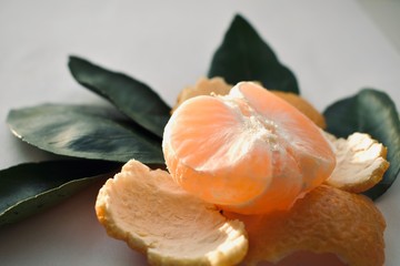 Tangerine or mandarin fruit with leaves on white background