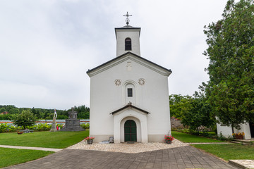 Naklejka premium Cokesina, Serbia - July 12, 2019: The Cokesina Monastery belongs to the Serbian Orthodox Church. A monument with a tomb was erected in the monastery port in memory of the Serbian uprisings.