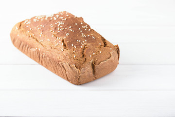 Homemade baked spelled bread on a wooden background.Horizontal photo.