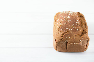 Homemade baked spelled bread on a wooden background.Horizontal photo.