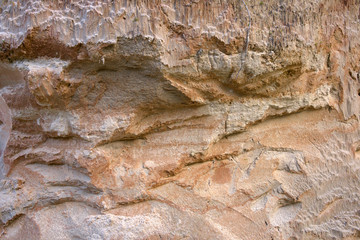 Cross section of sandy soil, relief vertical cut closeup, textured background image