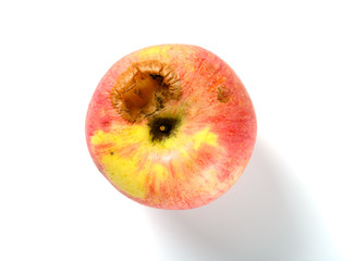 top view ripe apple bited by insect on white
