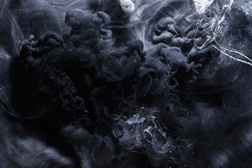 Abstract black and white swirling smoke background. Cumulus thunderclouds, mysterious and...