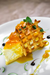 honey curd dessert with mint leaves on it