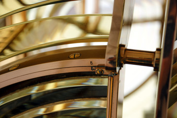 Lighthouse lens with brass structure and filaments lamp. Boanova lighthouse, Porto, Portugal.