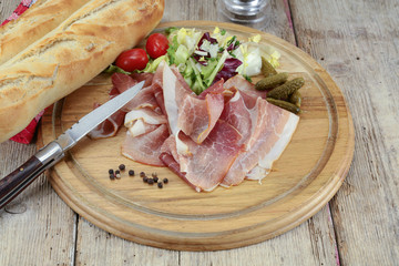 slice of dry ham on a cutting board