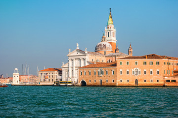 Fototapeta premium Bell tower and church of Saint George also called San Giorgio Maggiore in Venice, Italy