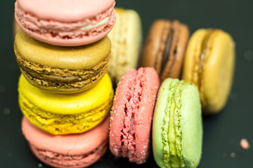 Close-up of a stack of pastel colored french macarons