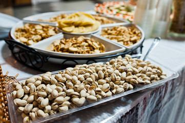 Dessert table of delicious snacks on wedding reception.