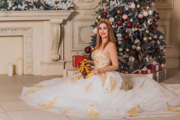 Gorgeous Christmas scene, lady in perfect evening dress in living room, Happy New Year time