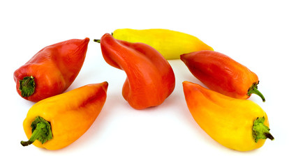 Red and yellow peppers on a white background