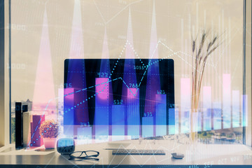 Stock market chart hologram drawn on personal computer background. Double exposure. Concept of investment.