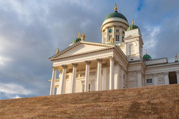 Fototapeta na wymiar Helsinki. Finland. Suurkirkko. Cathedral Of St. Nicholas. Cathedrals Of Finland. Panorama of the Senate square in the summer. Helsinki travel guide. Architecture of Helsinki