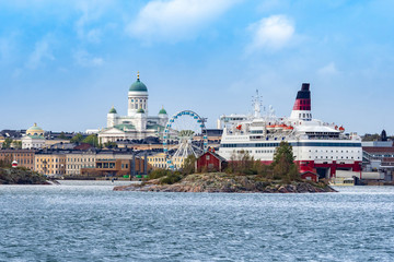 Helsinki. Finland. Cruise ship on the background of the panorama of Helsinki. Sights Of Helsinki. Ferris wheel. Suurkirkko. Cathedral Of St. Nicholas. Picturesque Islands in the Harbor. Scandinavia