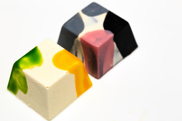 beautiful chocolate cubes placed on white background view