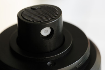 black cosmetic container or bottle spray head closeup view