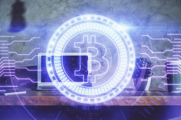 Multi exposure of blockchain theme hologram and table with computer background. Concept of bitcoin crypto currency.