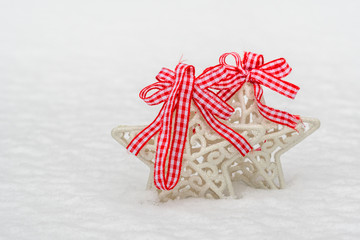 Fototapeta na wymiar Christmas decorations stars with a red bows