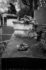 Paris, France - November 18, 2019: Graves and crypts in Pere Lachaise Cemetery, This cemetery is the final resting place for many famous people