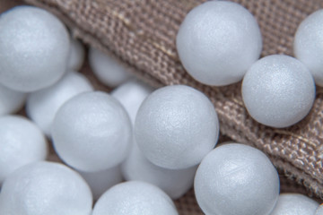 Close-up styrofoam beads on fabric