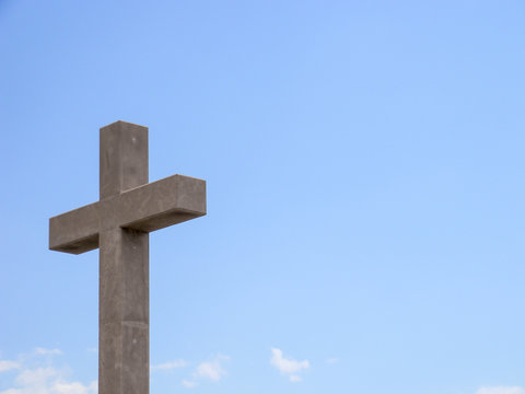 Isolated cross image with blue sky background.