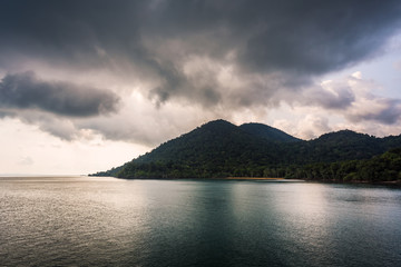Sea and island with the rain cloud background