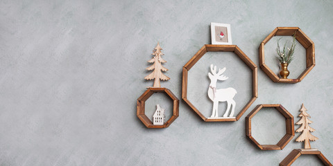 Christmas wood decoration on grey wall. Winter holidays. Pictire with copy space
