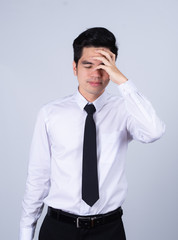 Portrait handsome young asian .businessman wearing a white shirt excitement or celebrating his victory sign isolated on grey background in studio. Asian man people. business success concept.