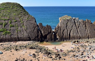 Atlantic ocean rocky coastline near Playa Del Portio Beach, Santander, Cantabria, Spain