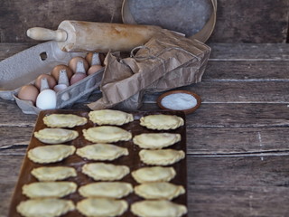 dumplings on a cutting board on a rustic table