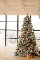 Christmas interior, Christmas tree in the room with large windows